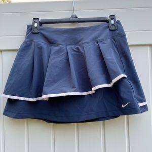 Navy nike tennis skort, with vintage emblem, size small